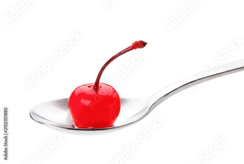 Canvastavla Single Vibrant Red Cherry Resting on a Metallic Spoon
