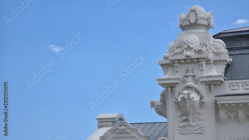 Fotografi Architectural detail of an ornate building facade against blue sky