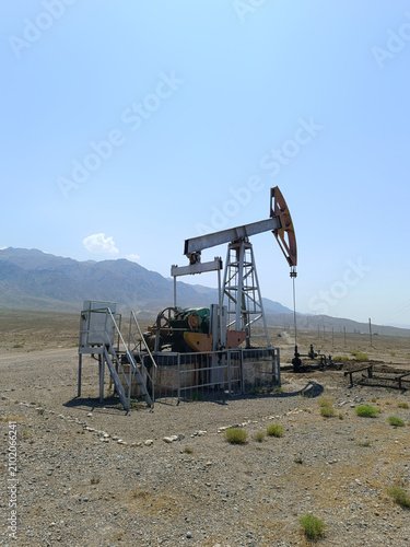 Cuadro en lienzo Petroleum Extraction Equipment with Mountains Background