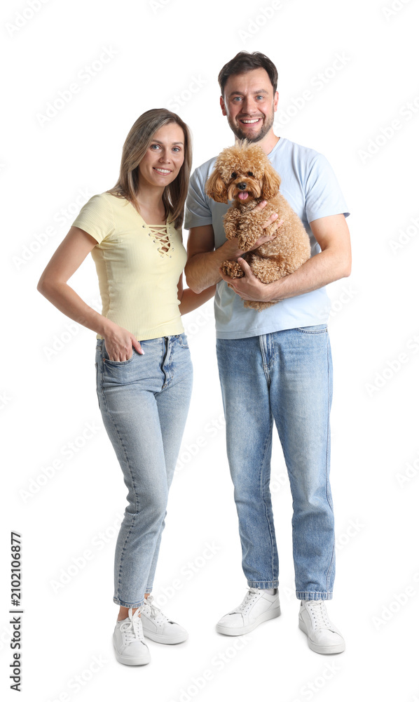 Fototapeta premium Happy couple and their cute dog on white background