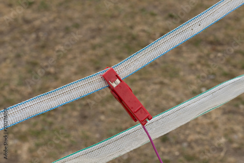 Photography Electric fence crocodile clip on the electric tape to electrify the fencing to stop horses or livestock escaping their field