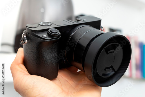 Foto Mirrorless digital camera with lens, hobby photography concept