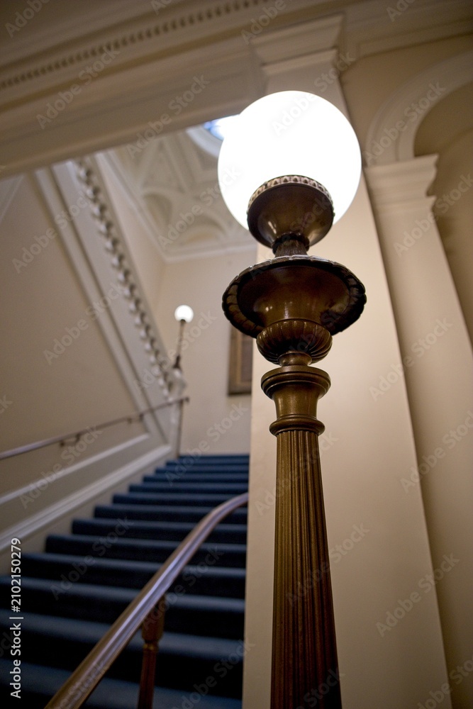 Obraz premium Elegant staircase with glowing lamp indoors