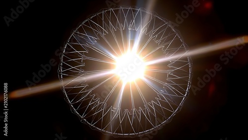 A radial metallic structure emits a strong central beam of light against a dark background.