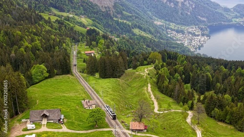 Cogwheel train climbing up Rigi mountain in Switzerland