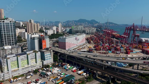 July 11 2026 Red gantry cranes load huge global container ships