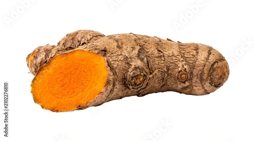 Fresh turmeric root with sliced cross section, organic orange turmeric rhizome on white background, raw ginger family spice for healthy cooking