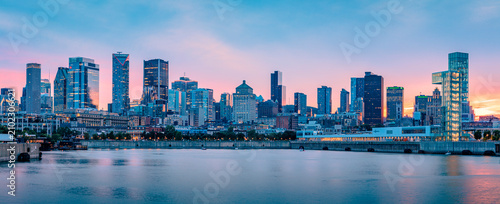 Panoramic view of the Montreal skyline at dusk from the Old Port, downtown skyscrapers along the Saint Lawrence River waterfront, Quebec, Canada