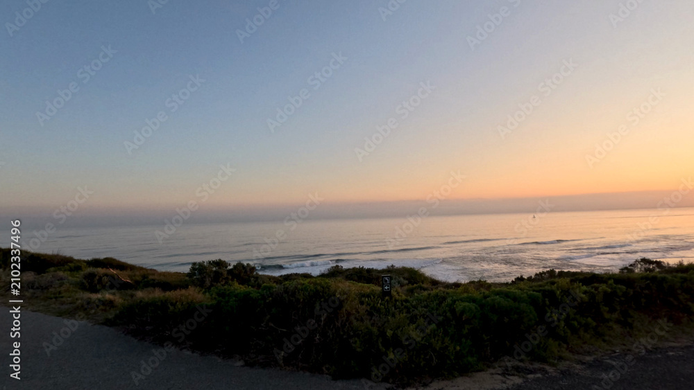 Fototapeta premium Sunset Over Ocean Horizon from Mornington Peninsula Coastal Road