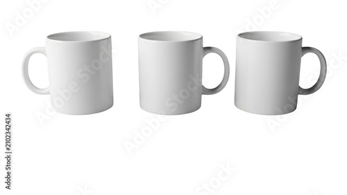 Three white ceramic mugs with handles isolated on transparent background