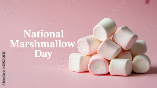 National Marshmallow Day celebration with a pile of white marshmallows on a pink background