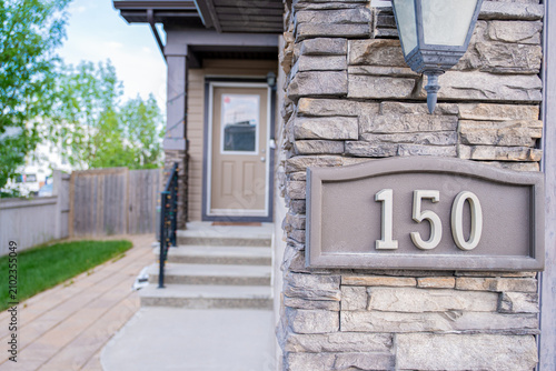 Street house number in front of residential home