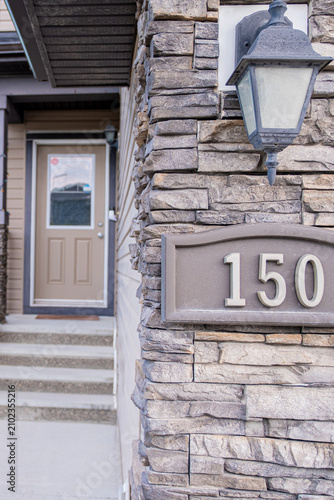 Street house number in front of residential home