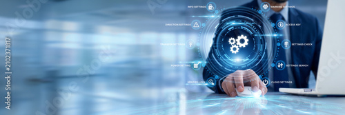 Businessman using a laptop for Settings data analysis, configuring system administration preference metrics, tuning backend network database controls, optimizing user interface customization profiles.