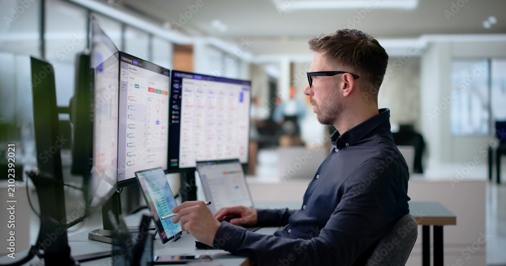 Fototapeta premium Compliance Officer Monitors Live Sanctions Alerts On Laptop