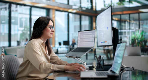 фотографія Young Woman Using AI Chatbot Platform On Laptop