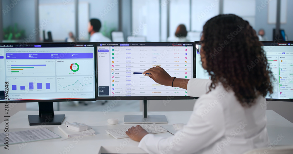 Obraz premium Young African American Healthcare Manager Reviews Medical Authorization
