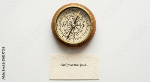 Vintage compass pointing north with inspirational quote 'Find your true path' on white background
