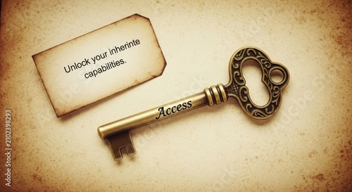 Vintage ornate key and old paper tag with inspirational message 'Unlock your inheritable capabilities' symbolizing access and potential.