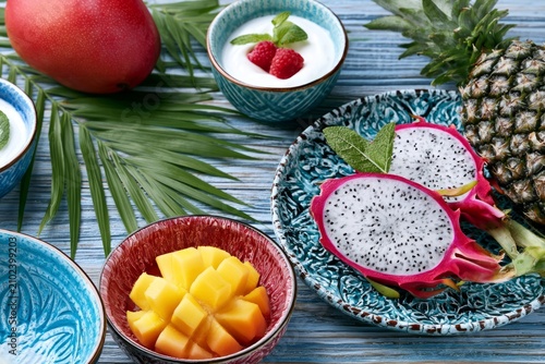 Beautifully Arranged Tropical Breakfast Featuring Exotic Fruits like Dragon Fruit, Mango, and Pineapple