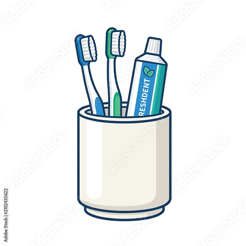 Toothbrushes and toothpaste in cup.