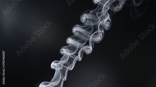 Elegant white smoke curls and wispy abstract waves rising on a dark background