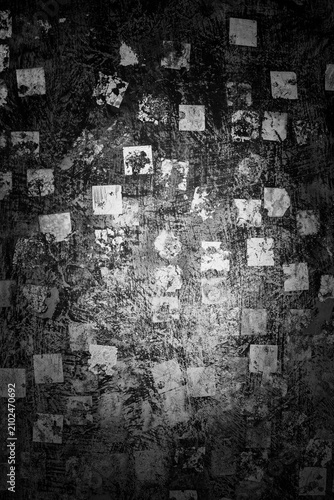 Dark grunge wall texture with distressed peeling paint