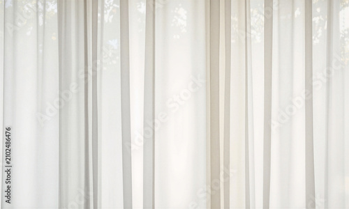 Curtains fabric translucent white layered curtains hanging in a bright room with copy space for minimalist interior design