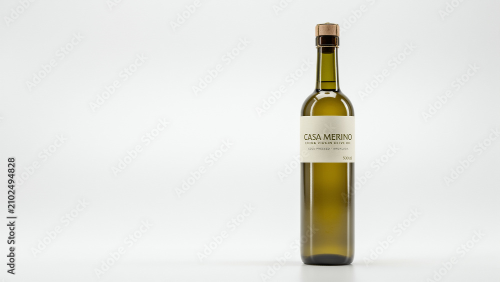 Obraz premium Green glass bottle of extra virgin olive oil with cork stopper and cream label against white background