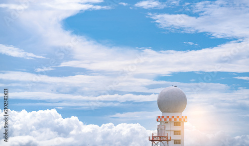 Photos Weather observations radar dome station against blue sky and white fluffy clouds