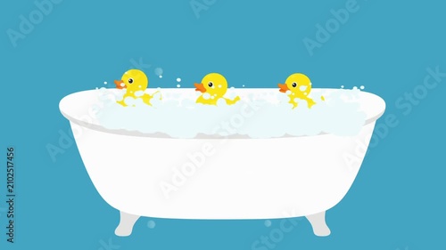 playful bathtub with duck toy floating and soap foam