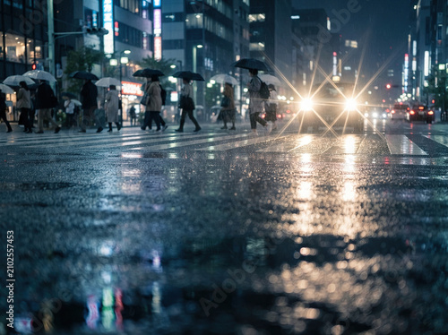 Busy Urban Pedestrians Crossing Wet Street at Rainy Night