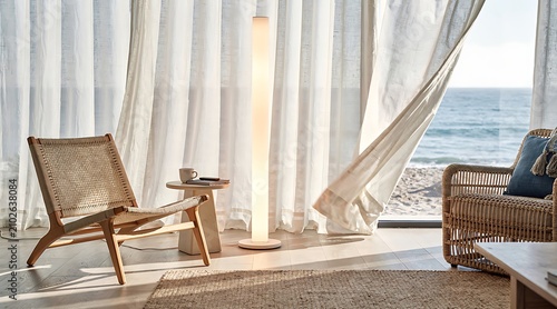 Modern minimalist living room with ocean view and natural light.