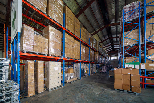 Interior of logistics warehouse with full of pallets and racks