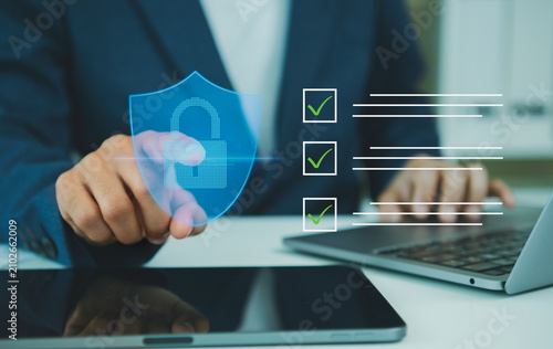 Картината върху платно Cybersecurity data protection checklist on laptop businessman verifying secure access privacy compliance risk management digital trust and enterprise information safety