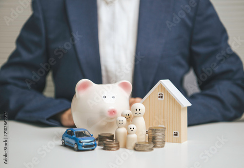 Fotografía Family financial protection with businessperson presenting piggy bank house car
