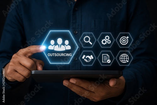 Business person using tablet with outsourcing concept hologram interface