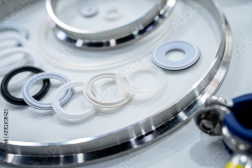 Photography Industrial gasket and sealing rings arranged on stainless steel surface in manufacturing