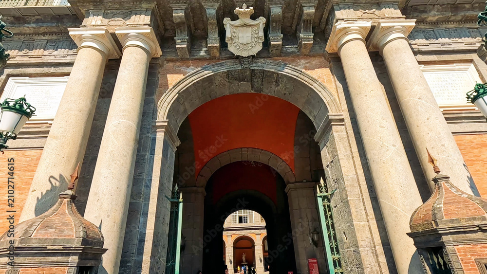 Obraz premium Grand Stone Archway Entrance of the Royal Palace in Naples