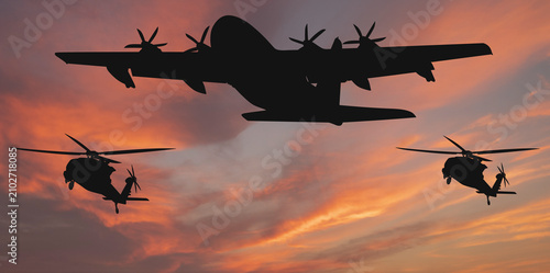 Canvas Print Silhouettes of a military transport aircraft and two combat helicopters against the backdrop of a sunset sky