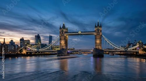 Iconic Tower Bridge Illuminated at Dusk Over the River Thames in London.