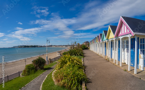 Bild auf Leinwand Wooden beach cabins along the beach front of Weymouth, Dorset, England