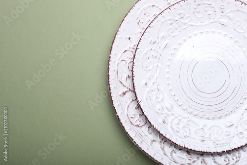 white plate on a wooden backgroundplates in the background