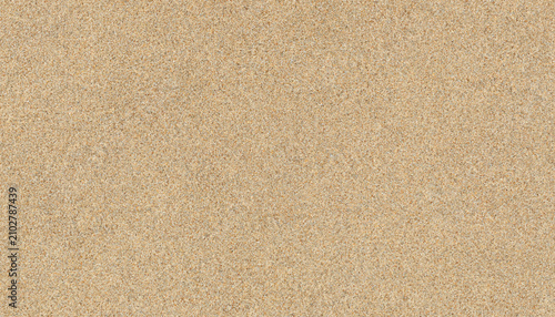Fotografie Detailed Closeup Texture of Light Brown Beach Sand Texture