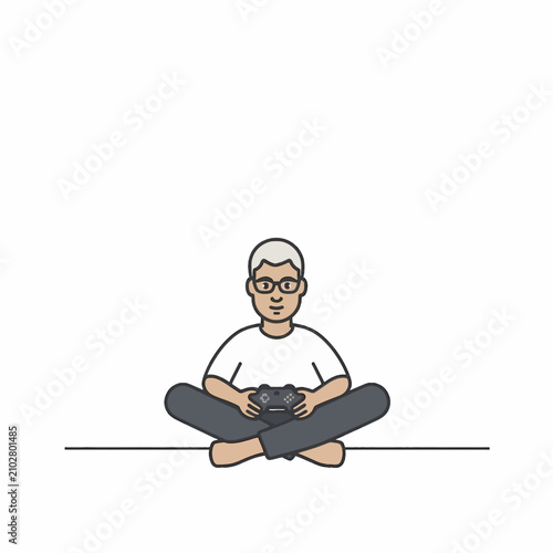 Young man sitting cross-legged playing video games with controller.