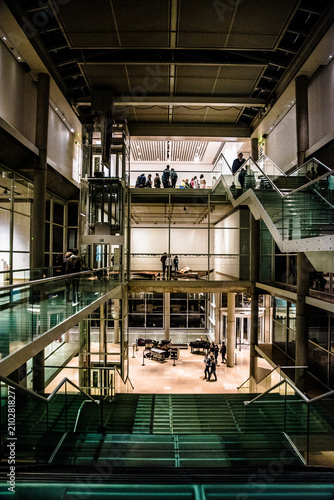 modern building interior with people walking and standing