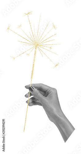 Surreal scrapbook art collage with human hand holding a golden sparkler on transparent background -  celebration, holiday magic, joy and festive moments