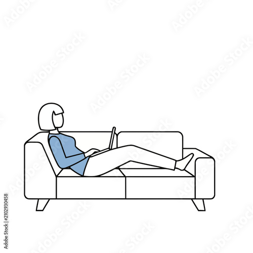 Woman using laptop on sofa