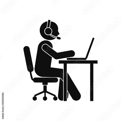 Obraz na płótnie Employee sits at a desk using a computer headset to facilitate professional communication tasks