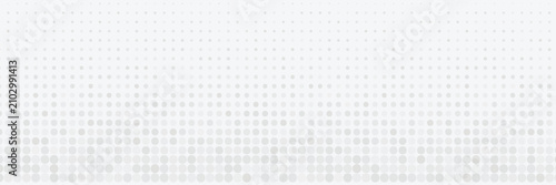 Obraz na plátně Abstract gray halftone dots gradient background with a smooth fade effect on a clean white backdrop